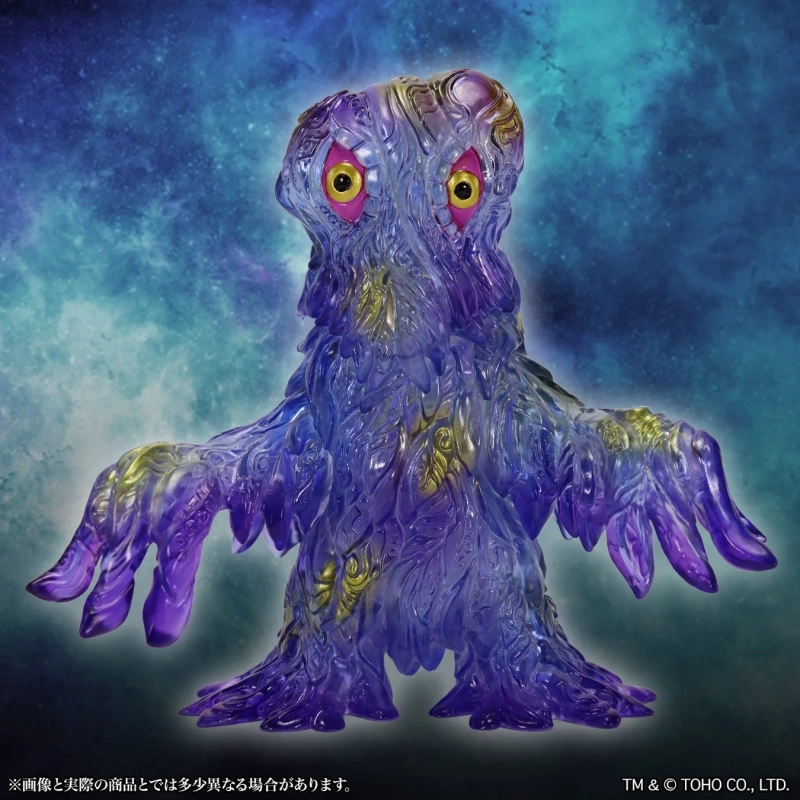 半透明の紫色をした怪獣のソフビフィギュア